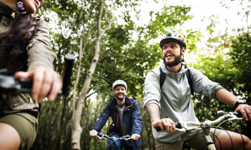 a group of men riding bikes in a Houston park