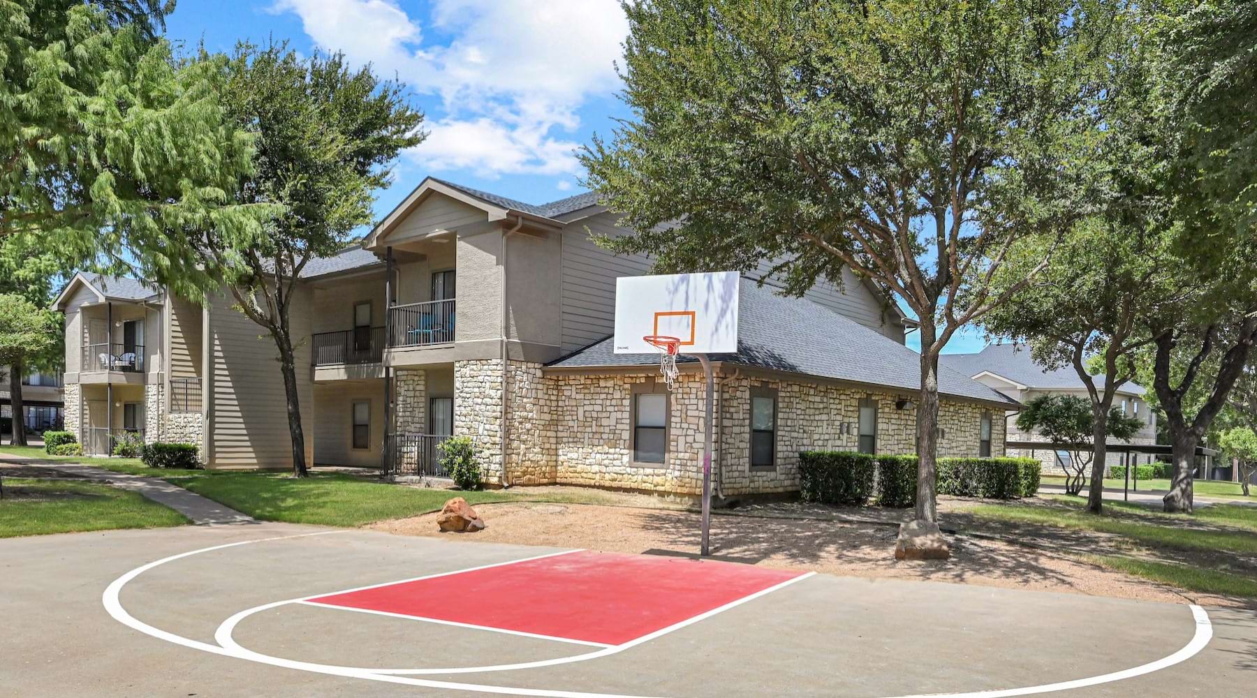 a basketball court in front of a building