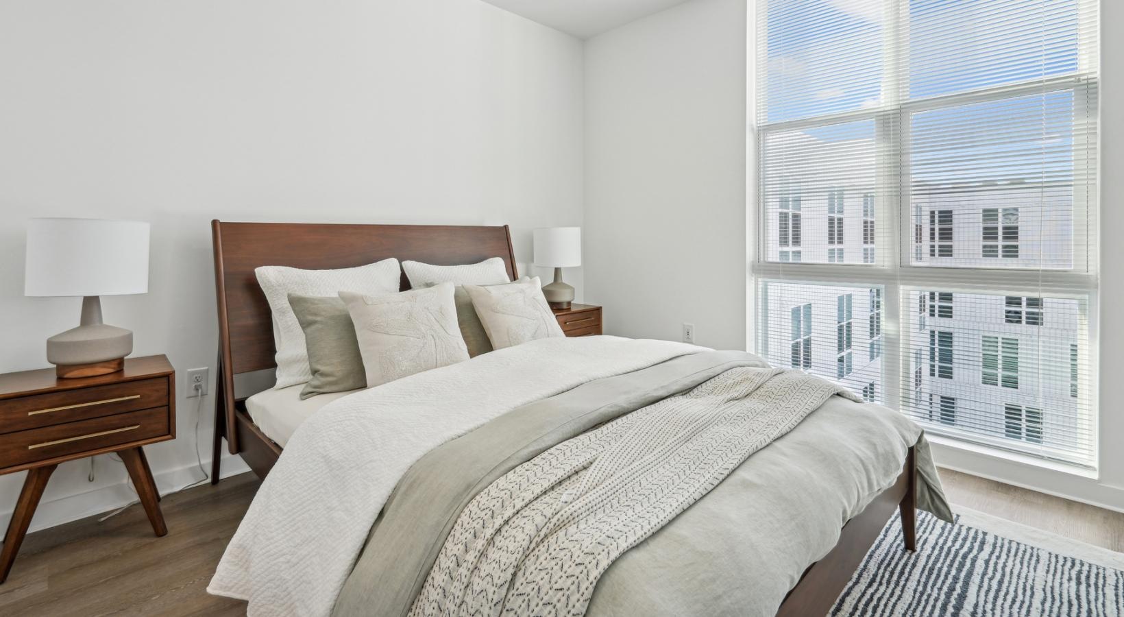 a bedroom with a large window