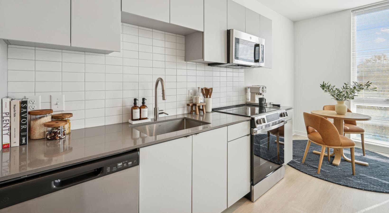 a kitchen with white cabinets
