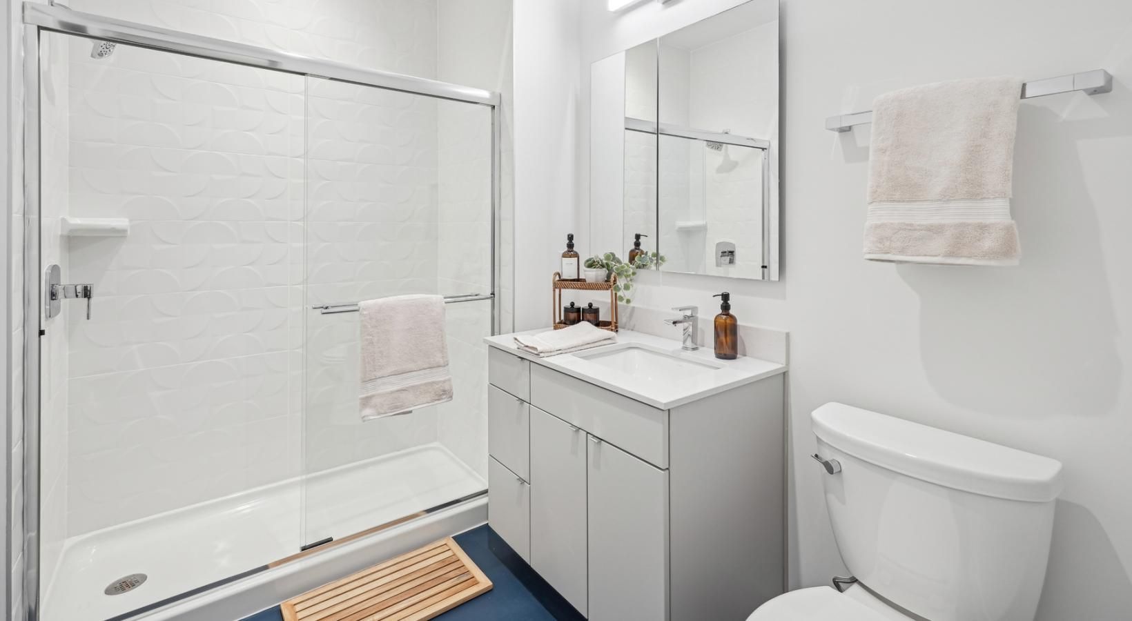 a bathroom with a shower and toilet