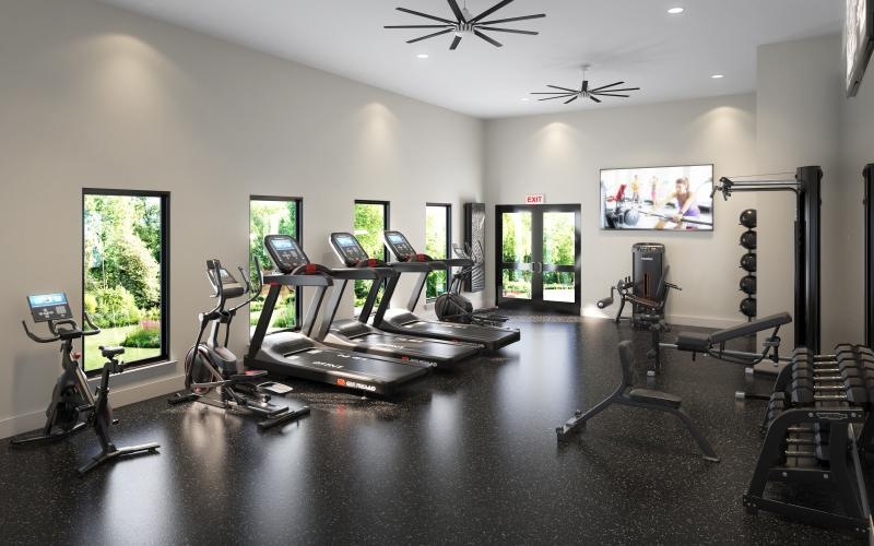 Gym with cardio and strength training equipment at Arbor Rose Porter luxury apartments near Humble, TX.