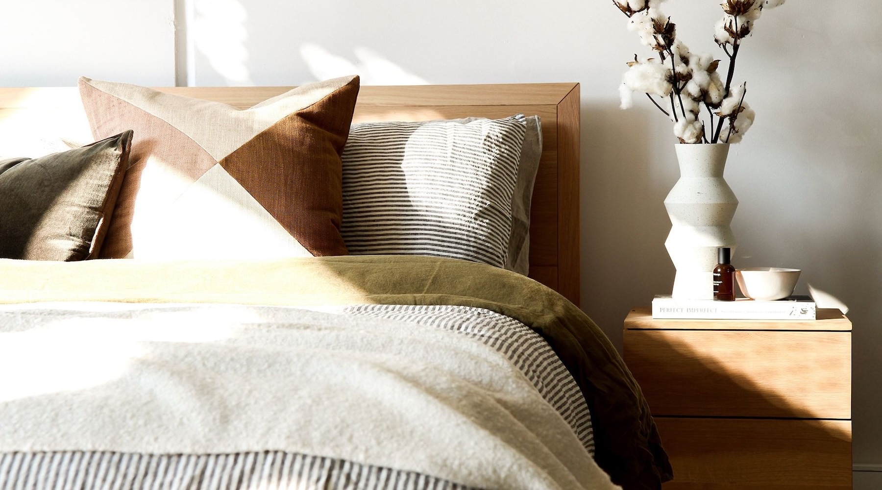 a bedroom with a bed and a nightstand