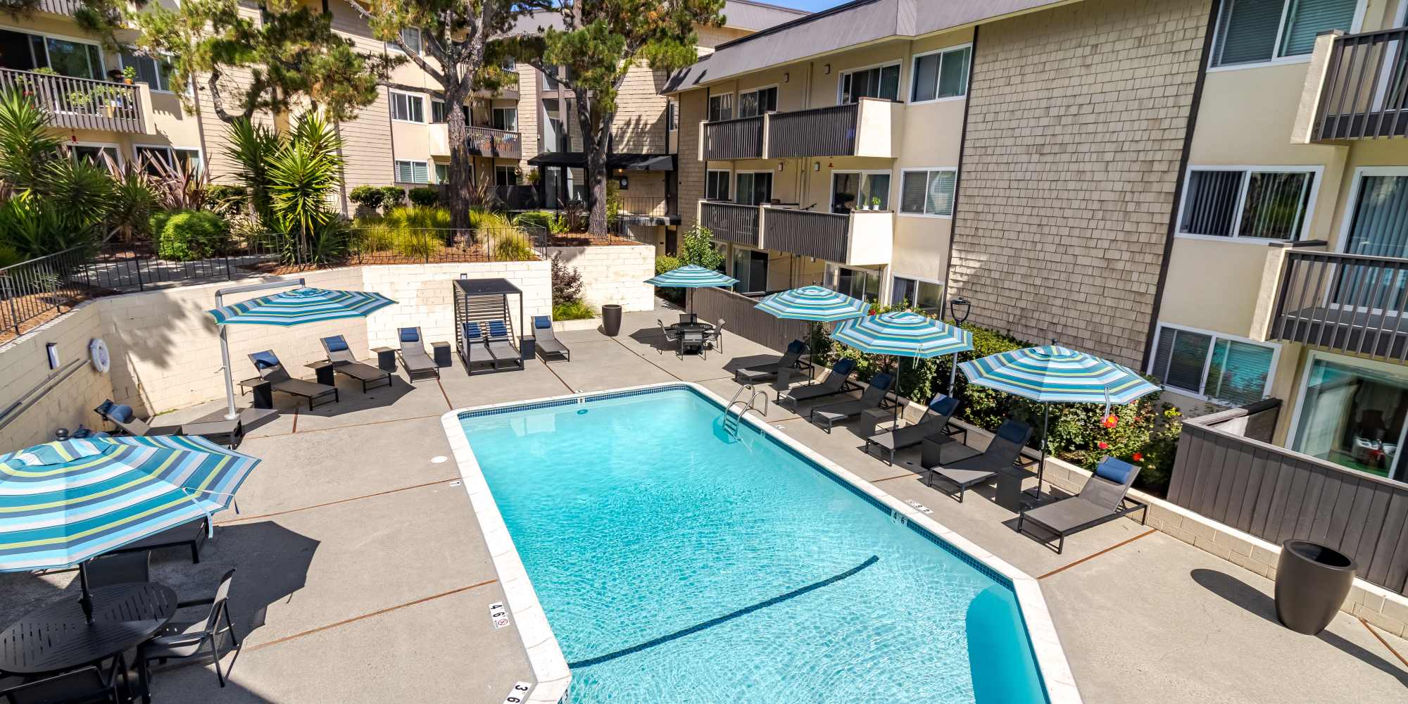 Building exterior and swimming pool area view at The Ralston at Belmont Hills in Belmont California