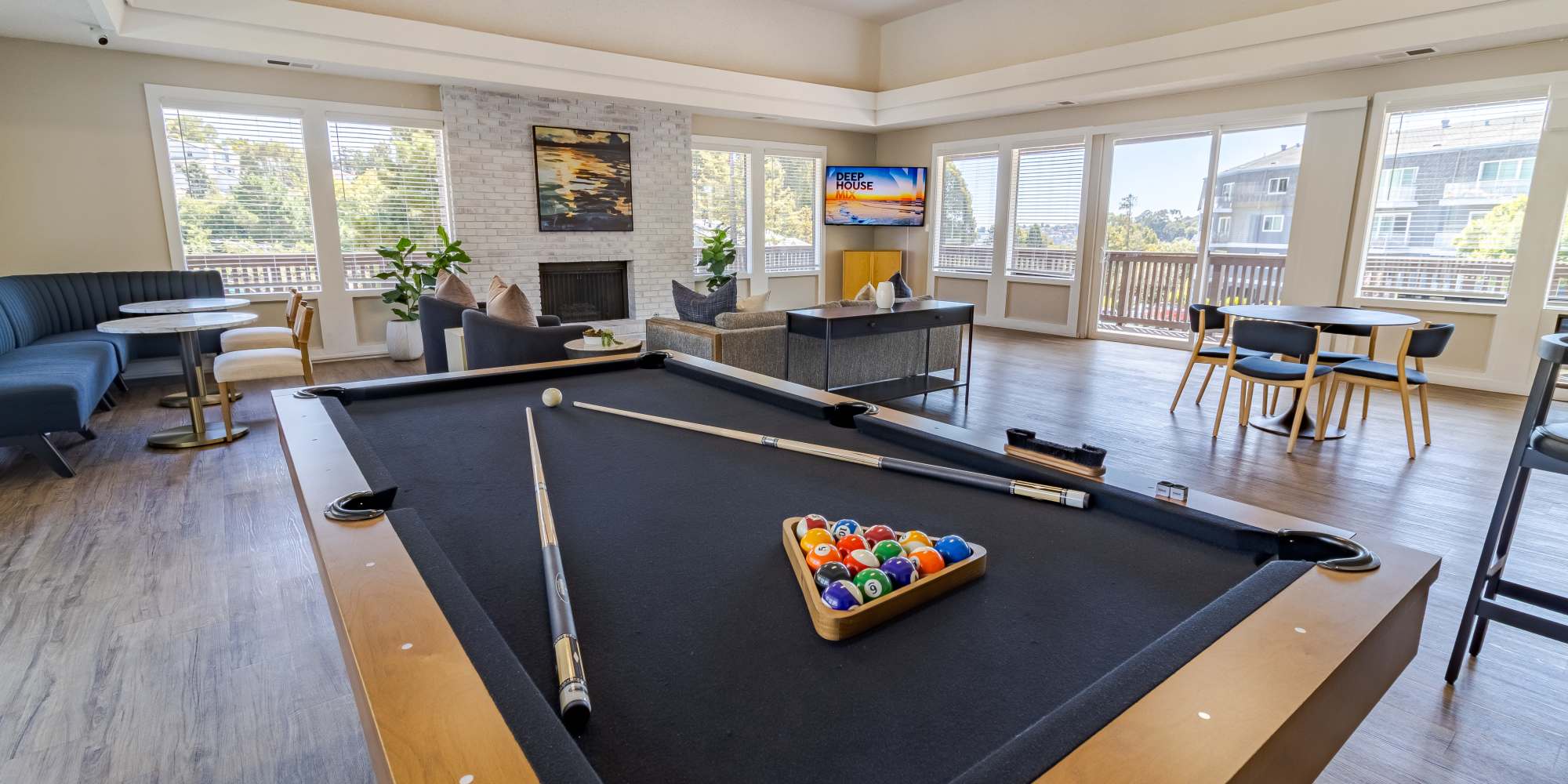 Game room with pool table setup at The Ralston at Belmont Hills in Belmont California