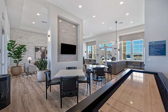 A modern dining room with a pool table.