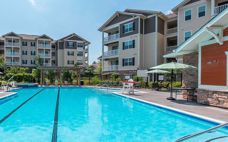 swimming pool with spacious seating areas and reclining chairs