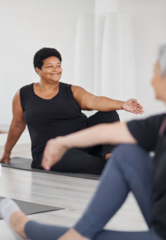 A group of people are practicing yoga in a studio.