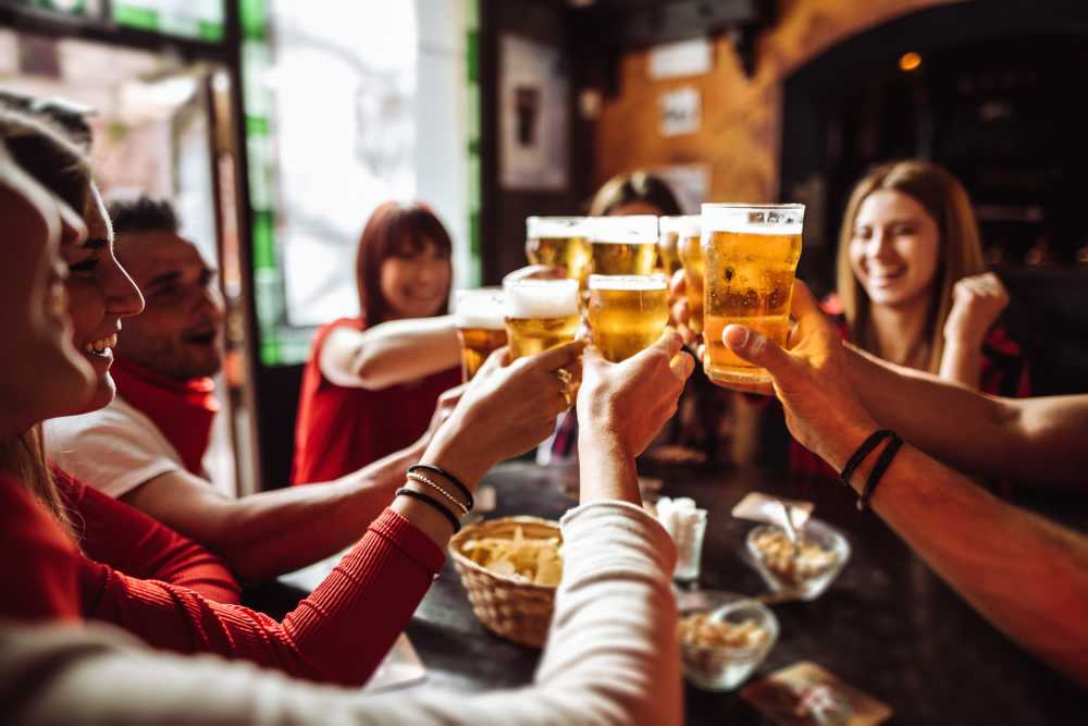 Residents having beer at a restaurant near Trails at Canyon Creek in Austin, Texas