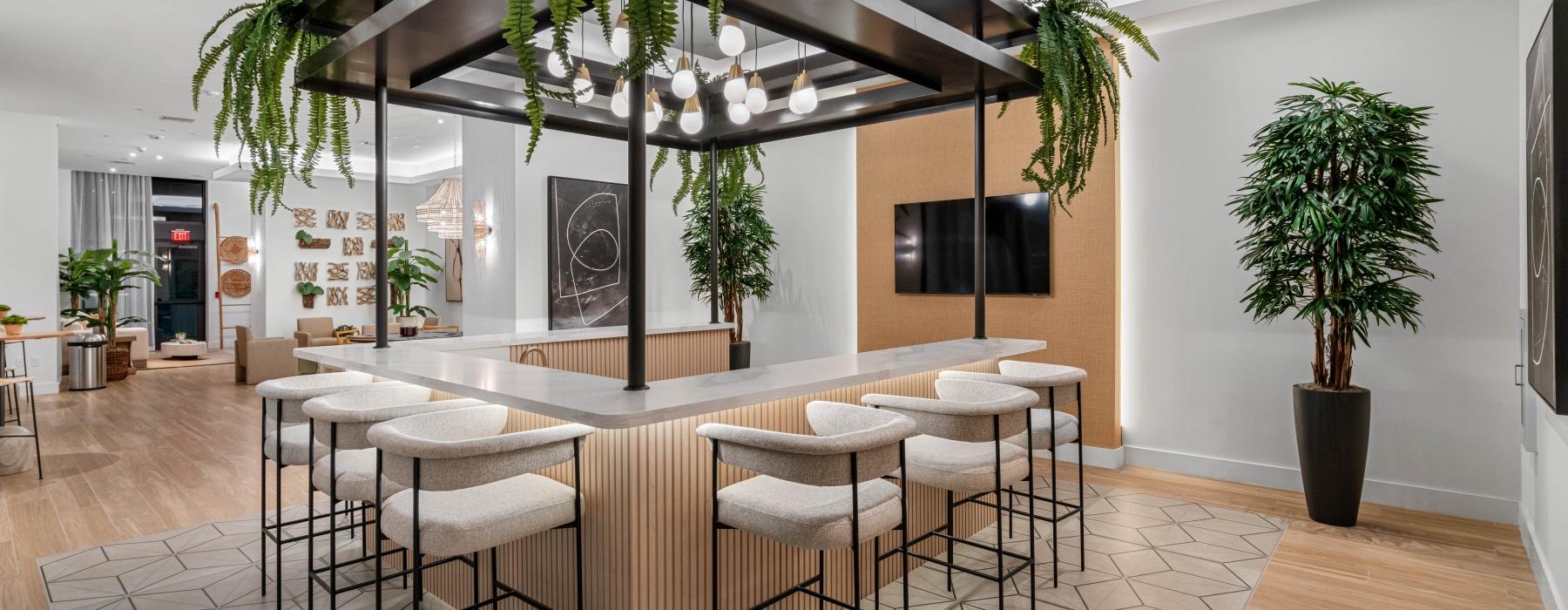 bar stools around c-shaped counter in clubhouse
