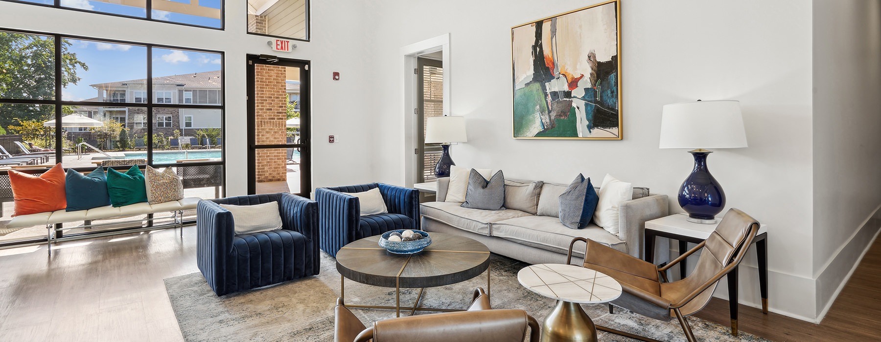 lounge with seating tables and windows