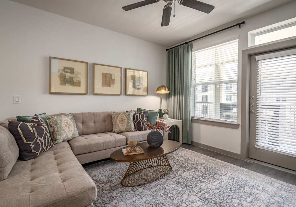 Living room with neutral color palette at Charleston at Fannin Station in Houston, Texas