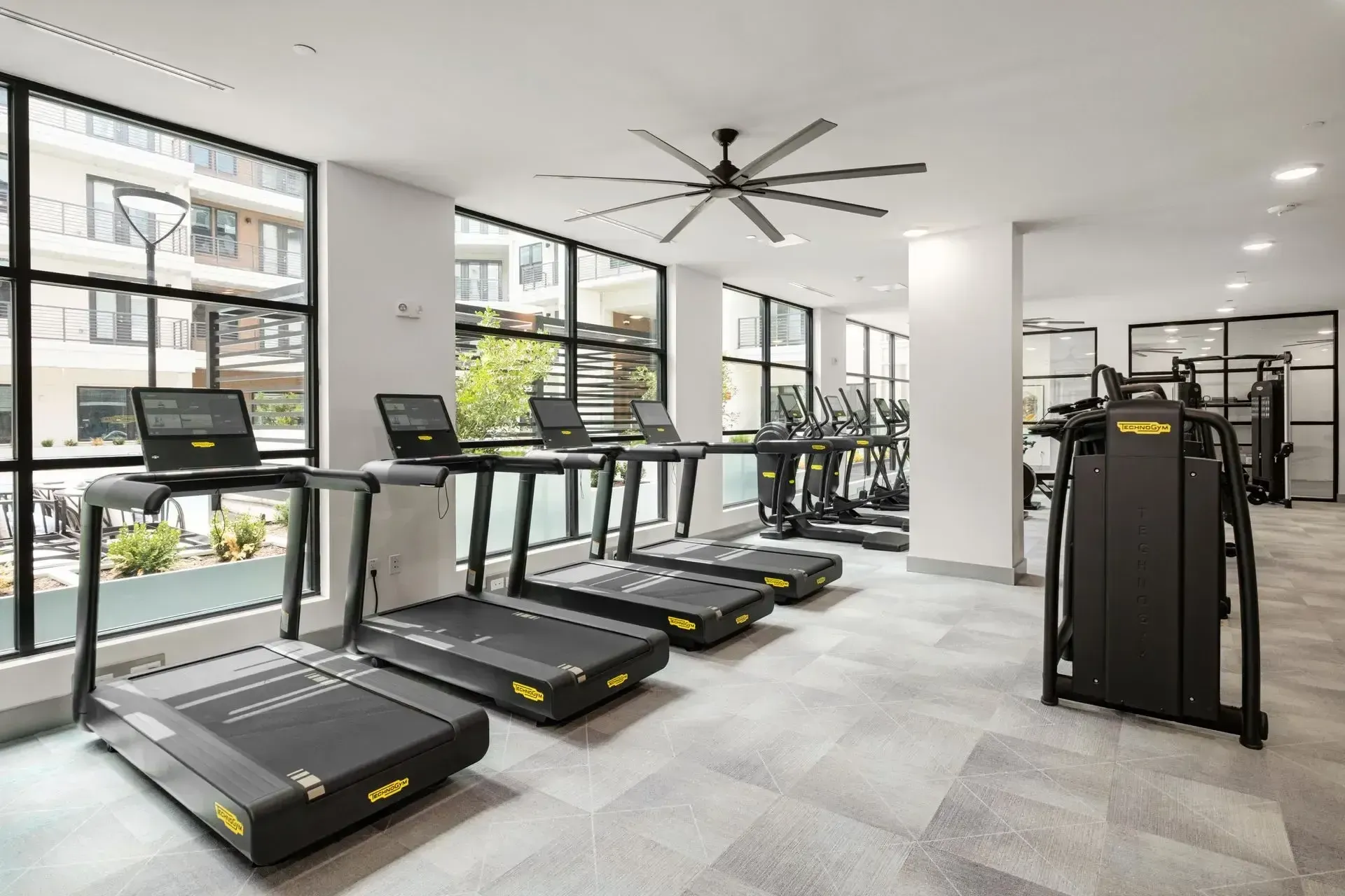 Fitness center with treadmills and ceiling fan