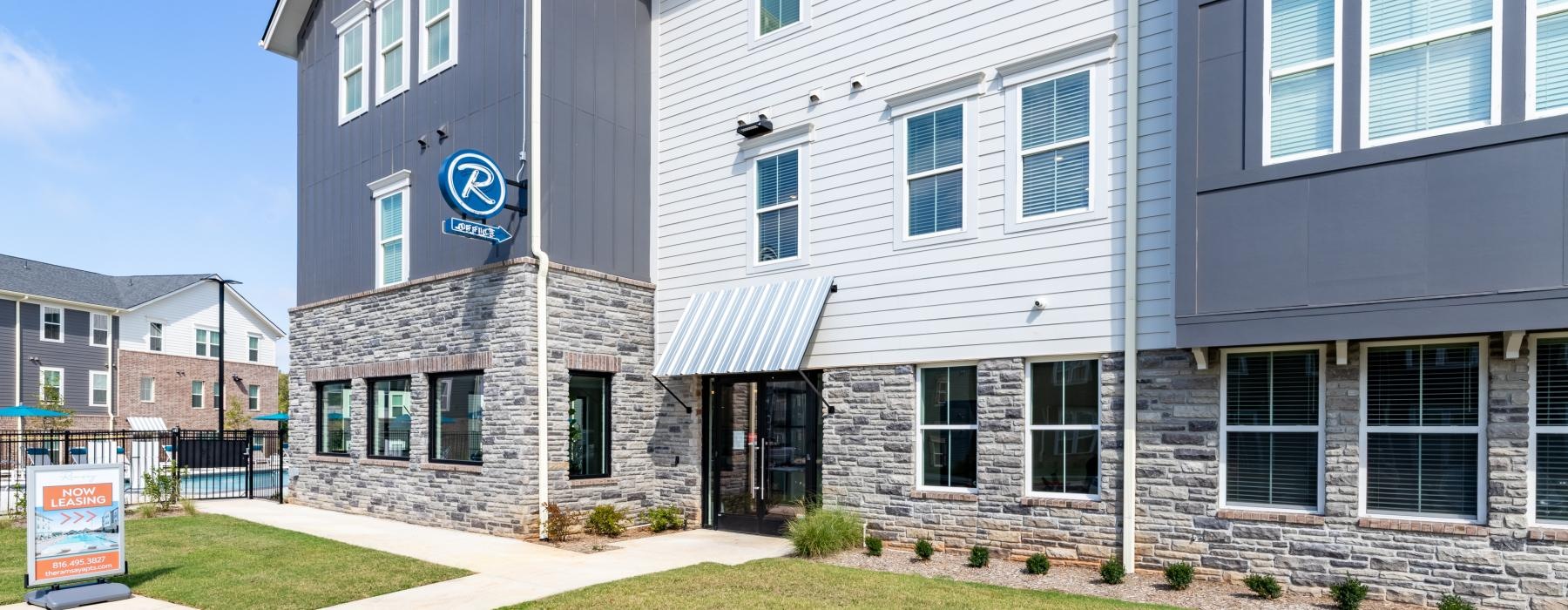 a building with a sign in front