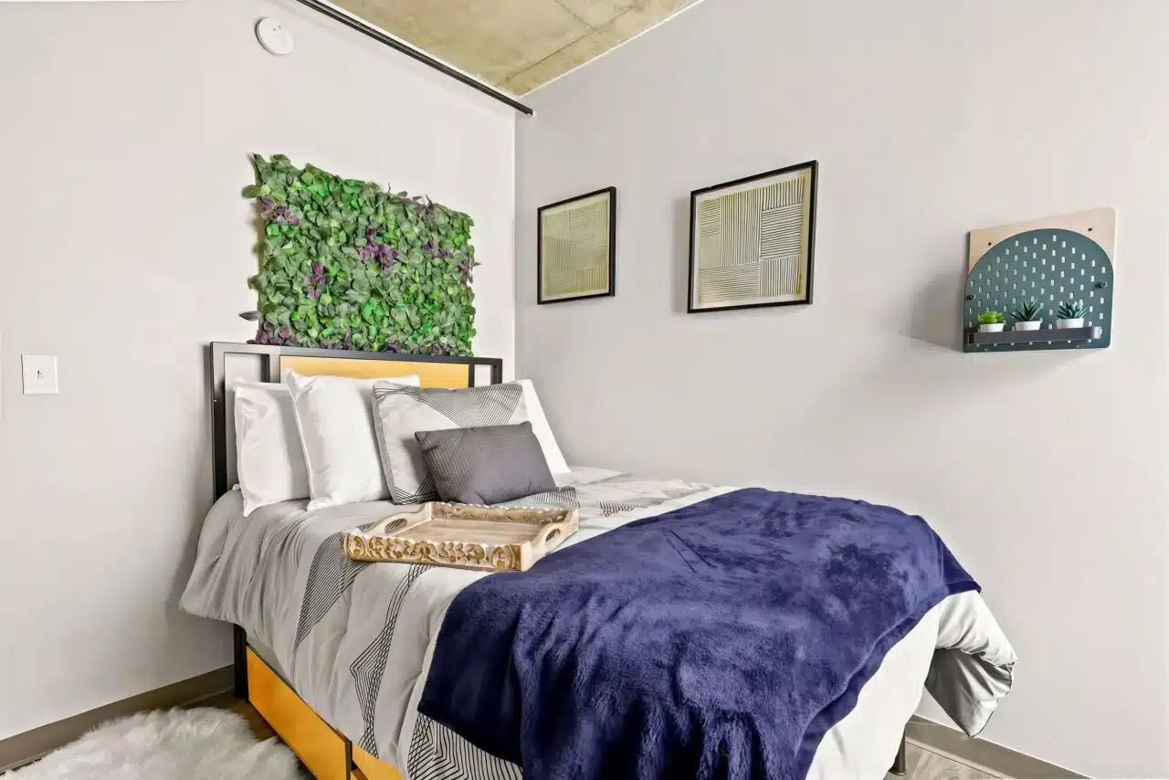 auraria-lofts-apartments-near-auraria-campus-denver-cozy bedroom at Auraria Lofts featuring 9-foot ceilings, and modern furnishings.