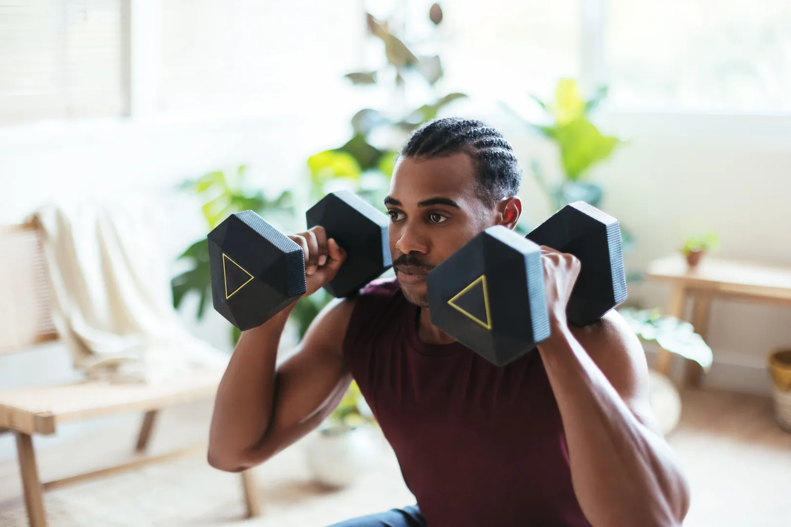 Man lifting dumbbells during a workout