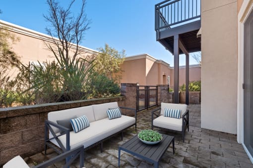 Dog-Friendly Apartments in Novato, CA - Millworks - Gated Patio with Plush Seating, CoffeeTable, and Maintained Landscaping