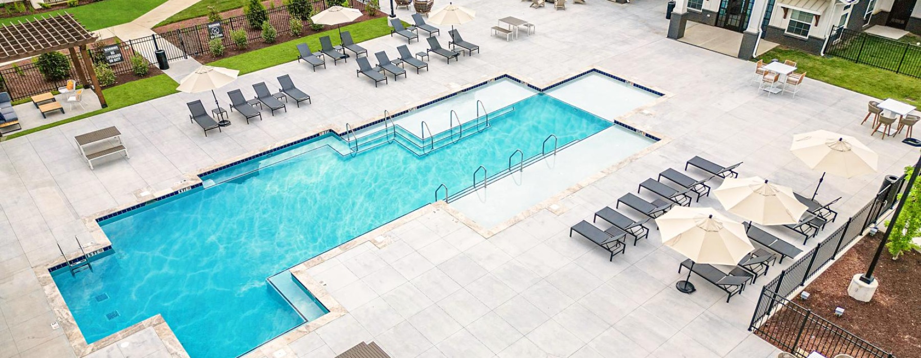 A pool deck surrounded by tanning beds