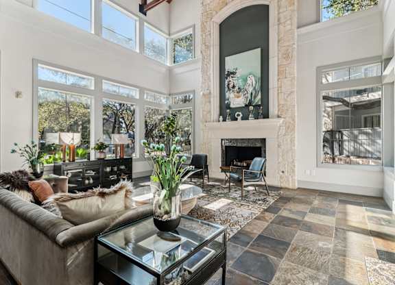 A living room with a fireplace and a couch.