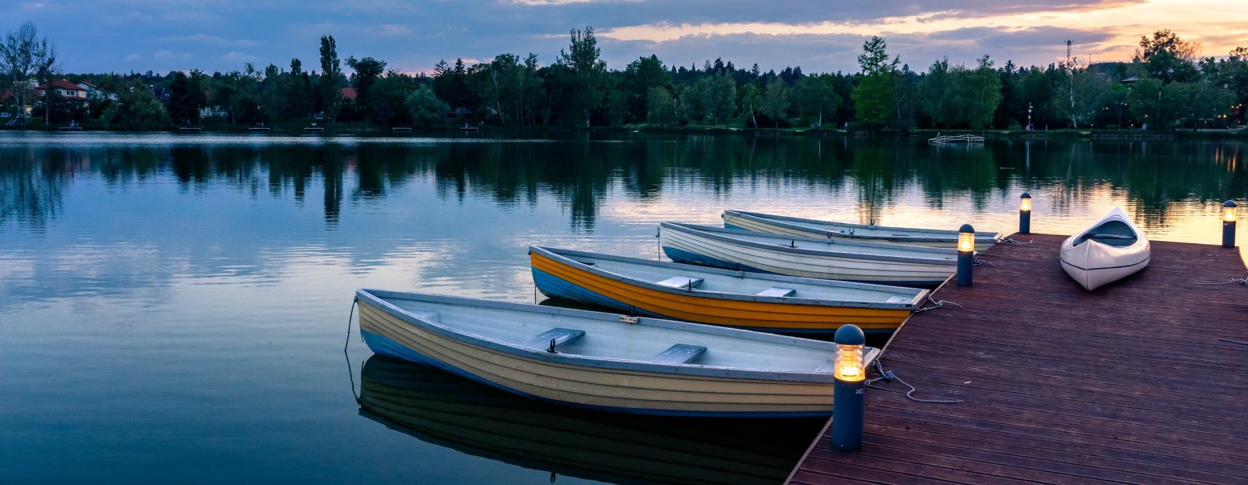 a group of boats tied to a dock