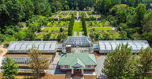 Aerial view of Reynolda Gardens near Sugar Creek Apartments in Winston-Salem NC featuring botanical gardens, walking trails, and greenhouse conservatory close to Wake Forest University.