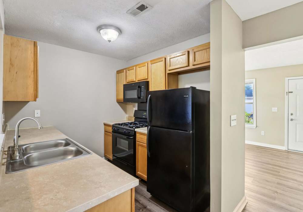 Kitchen with modern appliances at Fox Pointe Apartments in Columbus, Indiana