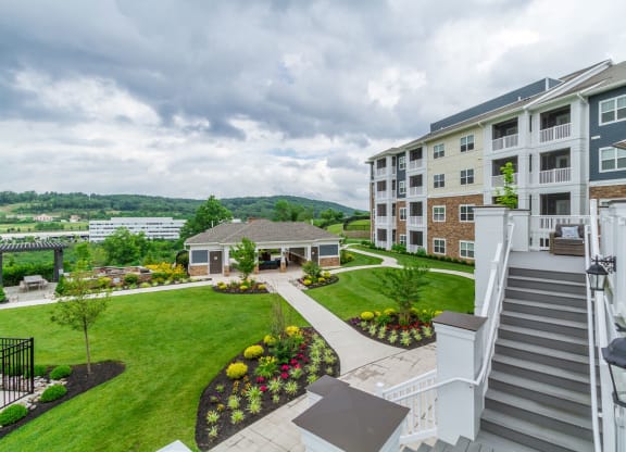 an aerial view of an apartment complex with a green lawn