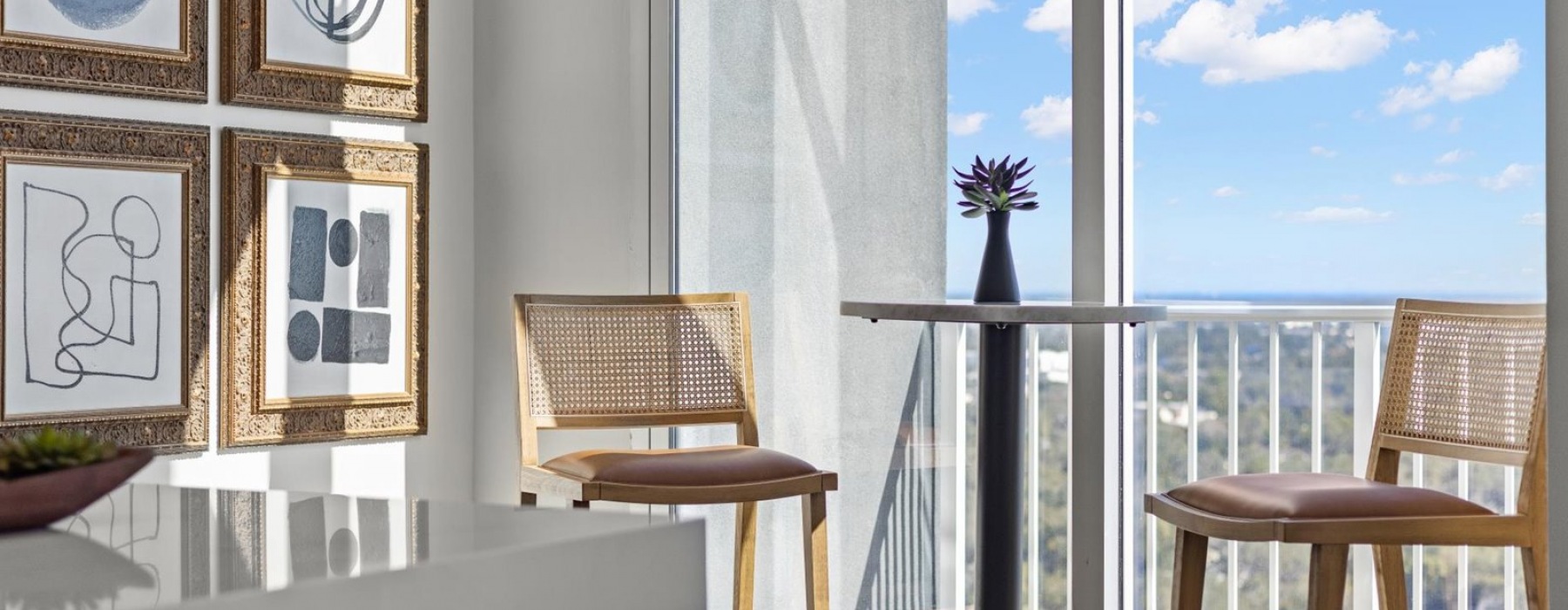 a spacious well-lit room with a city view