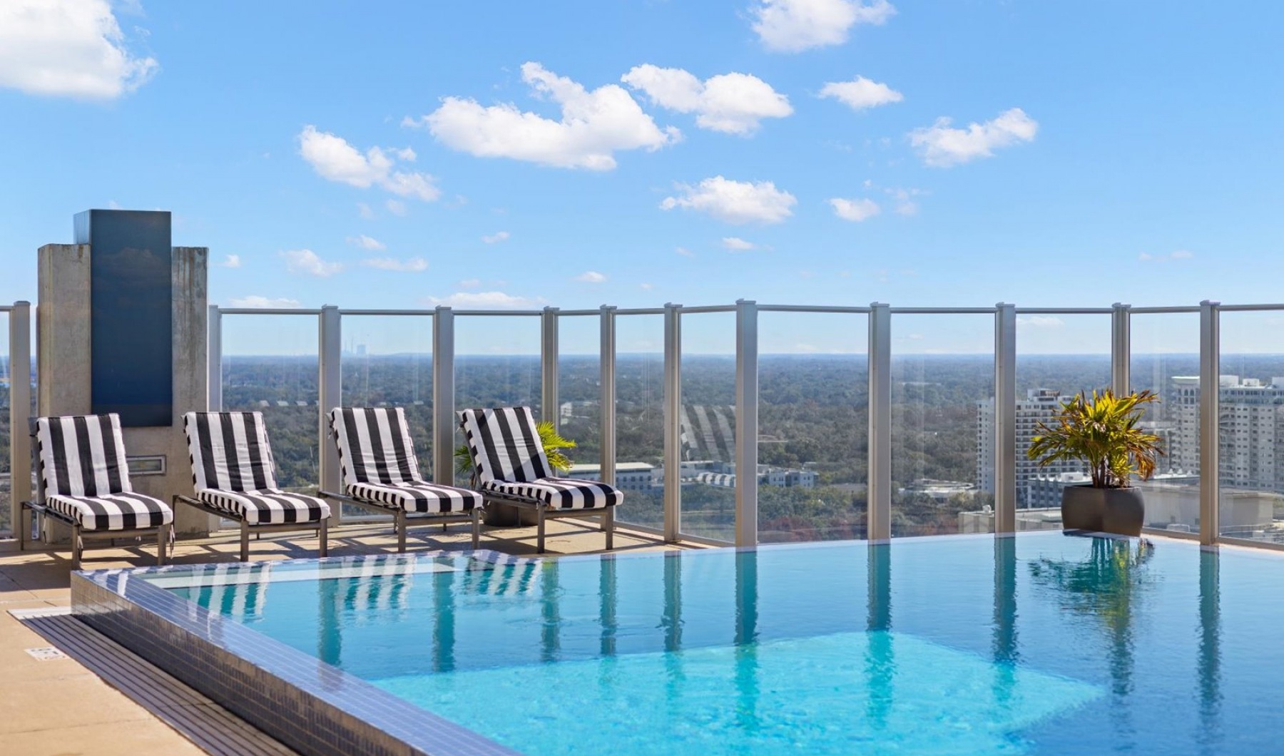 a swimming pool over-looking a city
