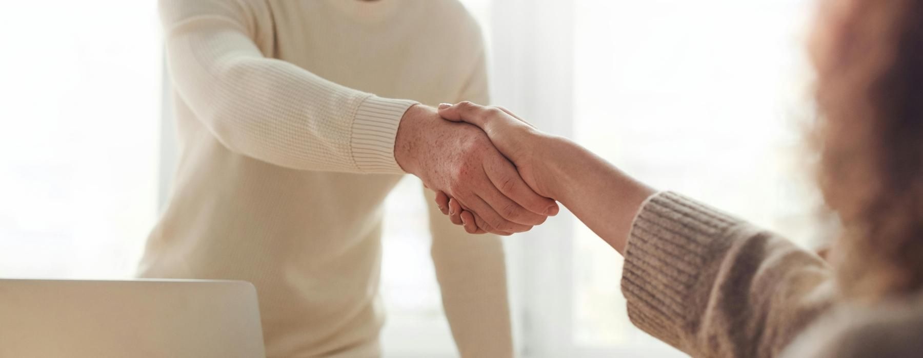 a man and a woman shaking hands