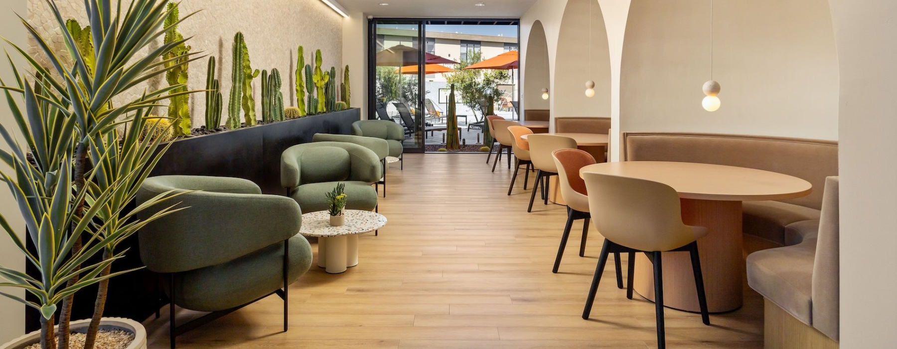 a spacious lounge with ample seating and lighting