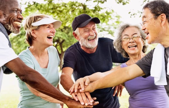 Group of Senior People Laughing at Anchor at Gulf Harbors 62+ Apartments, New Port Richey, FL