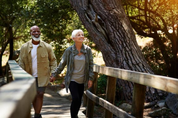A Couple Walking in the Park at Anchor at Gulf Harbors 62+ Apartments, New Port Richey, FL, 34652