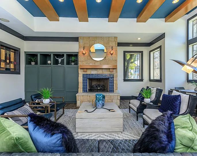 stylish clubhouse with fireplace and industrial ceiling