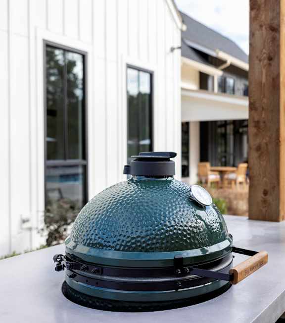A large green dome-shaped object is on a white surface.