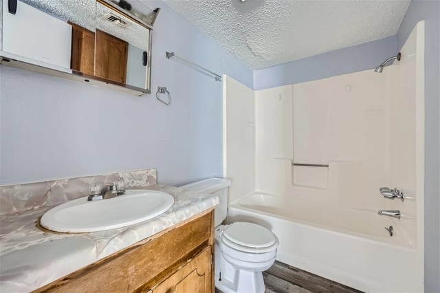 Bathroom with toilet, sink, and bathtub