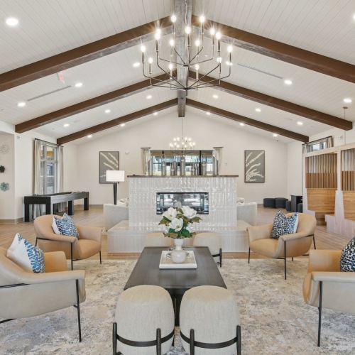 a spacious clubroom with ample seating and lighting