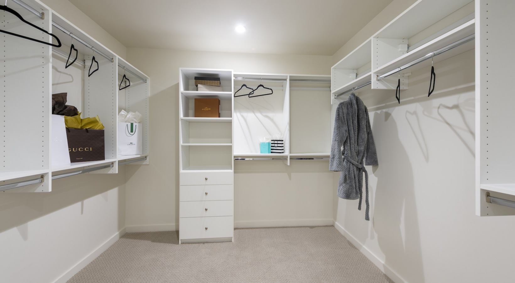 A spacious closet with shelves at One Hermann Place apartments for rent in Houston, TX.