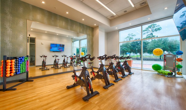 Large spinning room with huge windows 