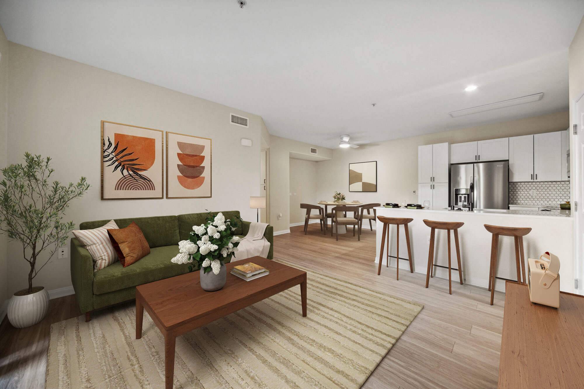 Apartment living room with view of kitchen and dining room.
