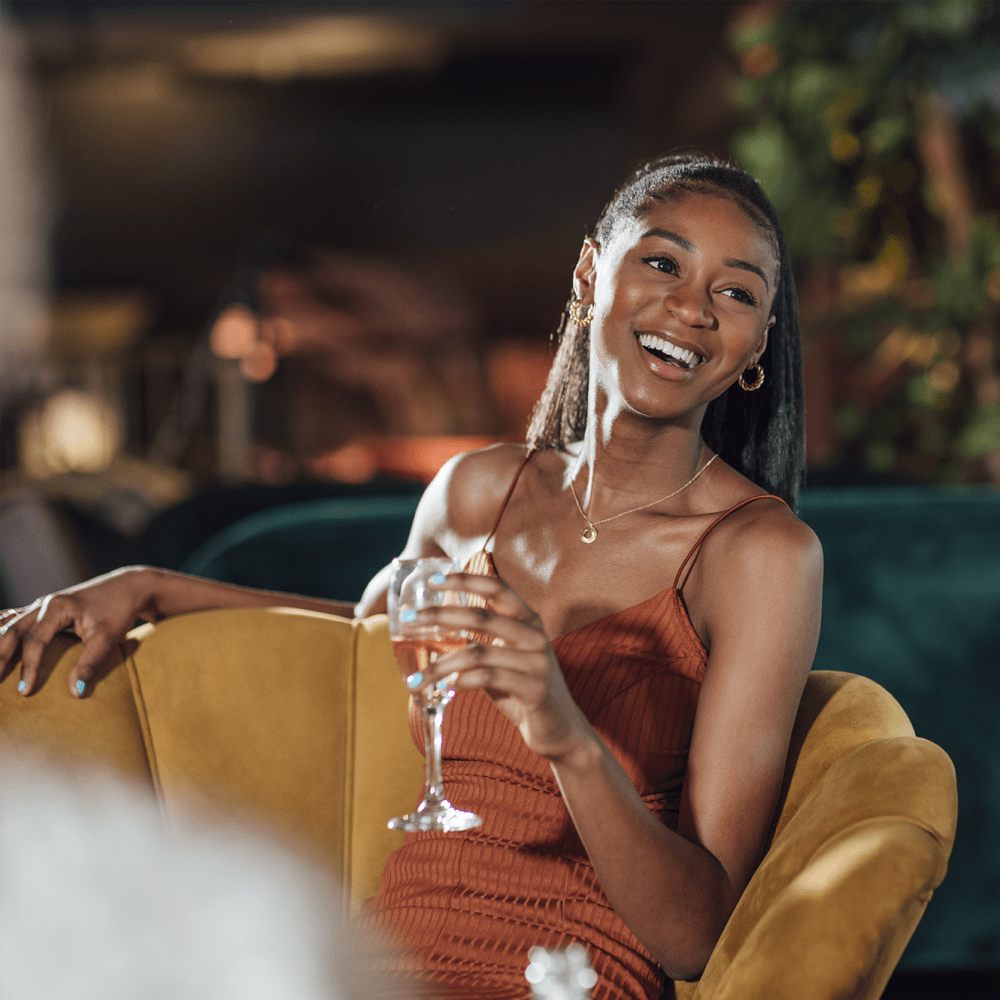 Resident enjoying a drink near The Fredd Townhomes in San Antonio, Texas
