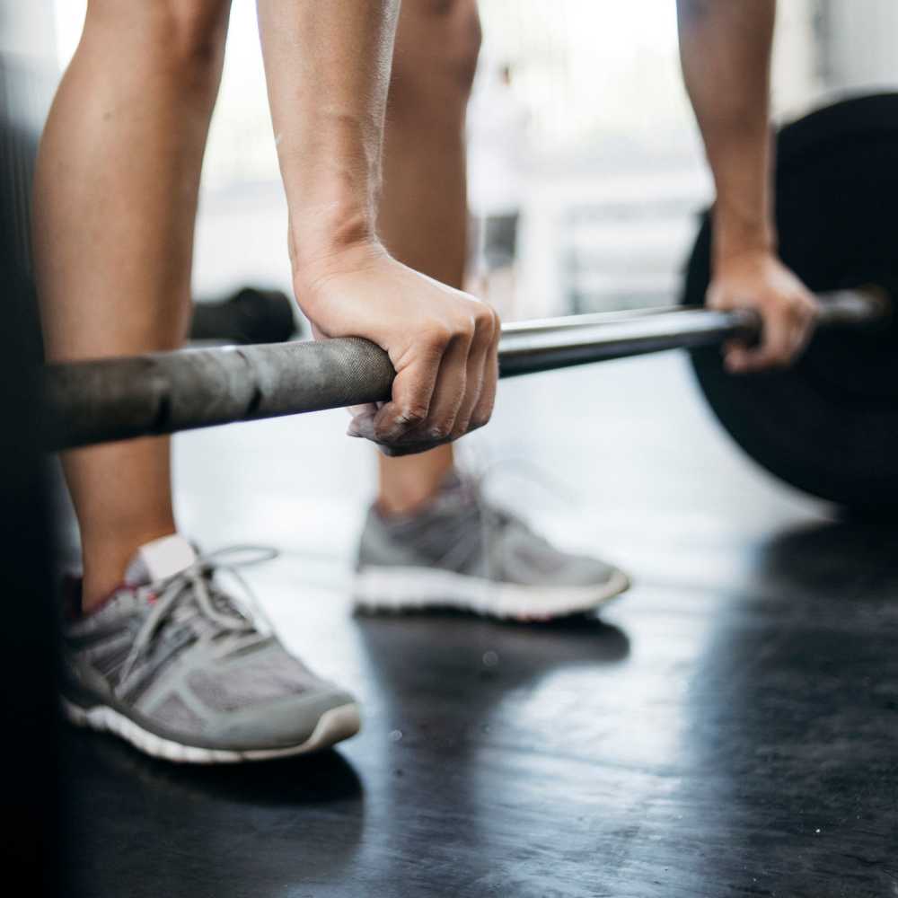 Resident working out in the fitness center at The Fredd Townhomes in San Antonio, Texas