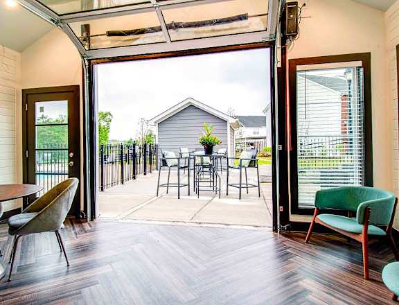 A patio with a table and chairs is shown.