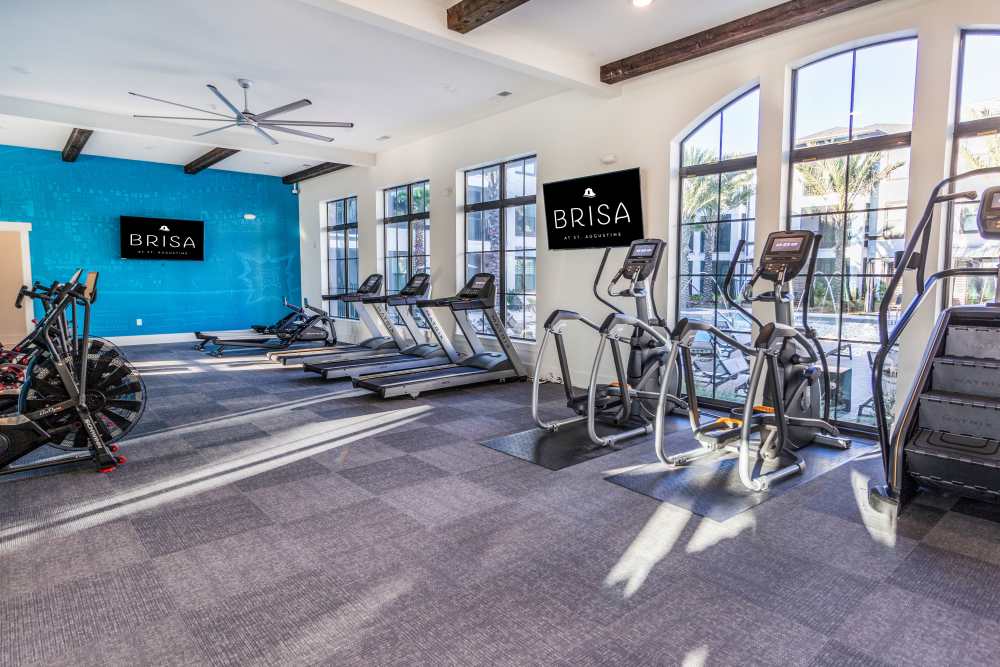 Fitness center with cardio machines and weights at Brisa at St. Augustine in St. Augustine, Florida