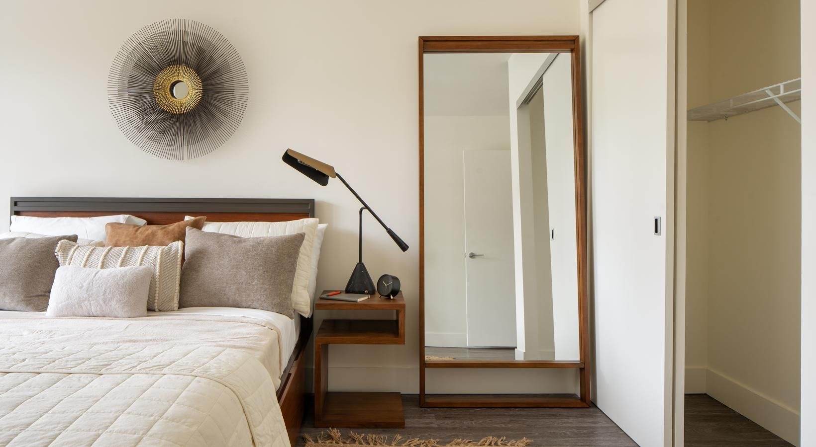 a bedroom with a fan and a bed