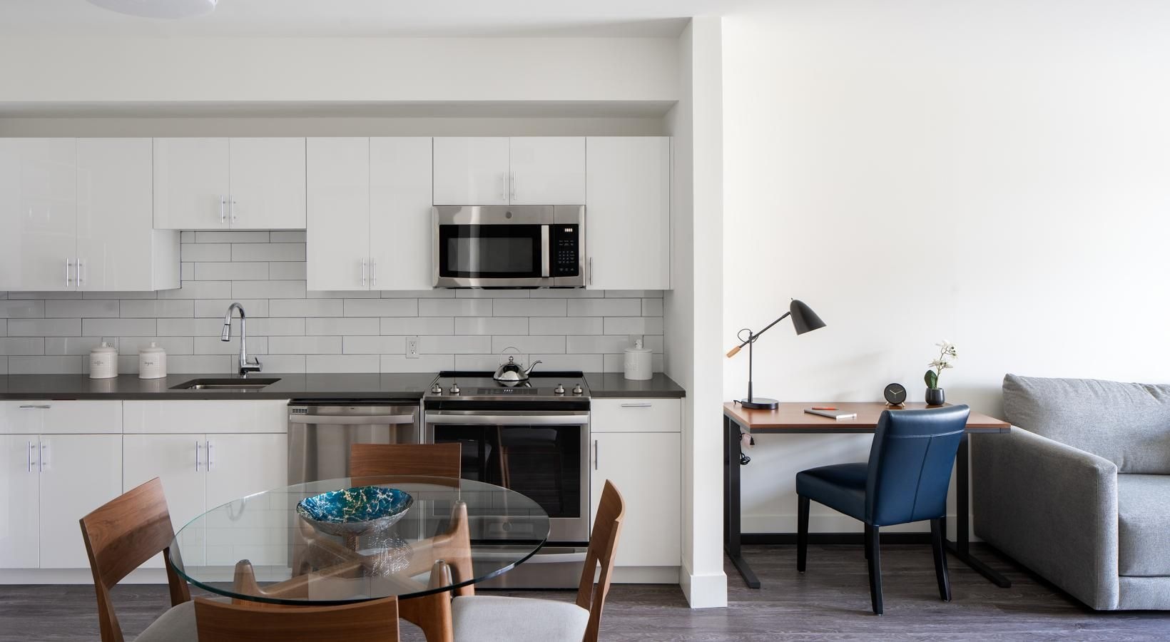 a kitchen with white cabinets