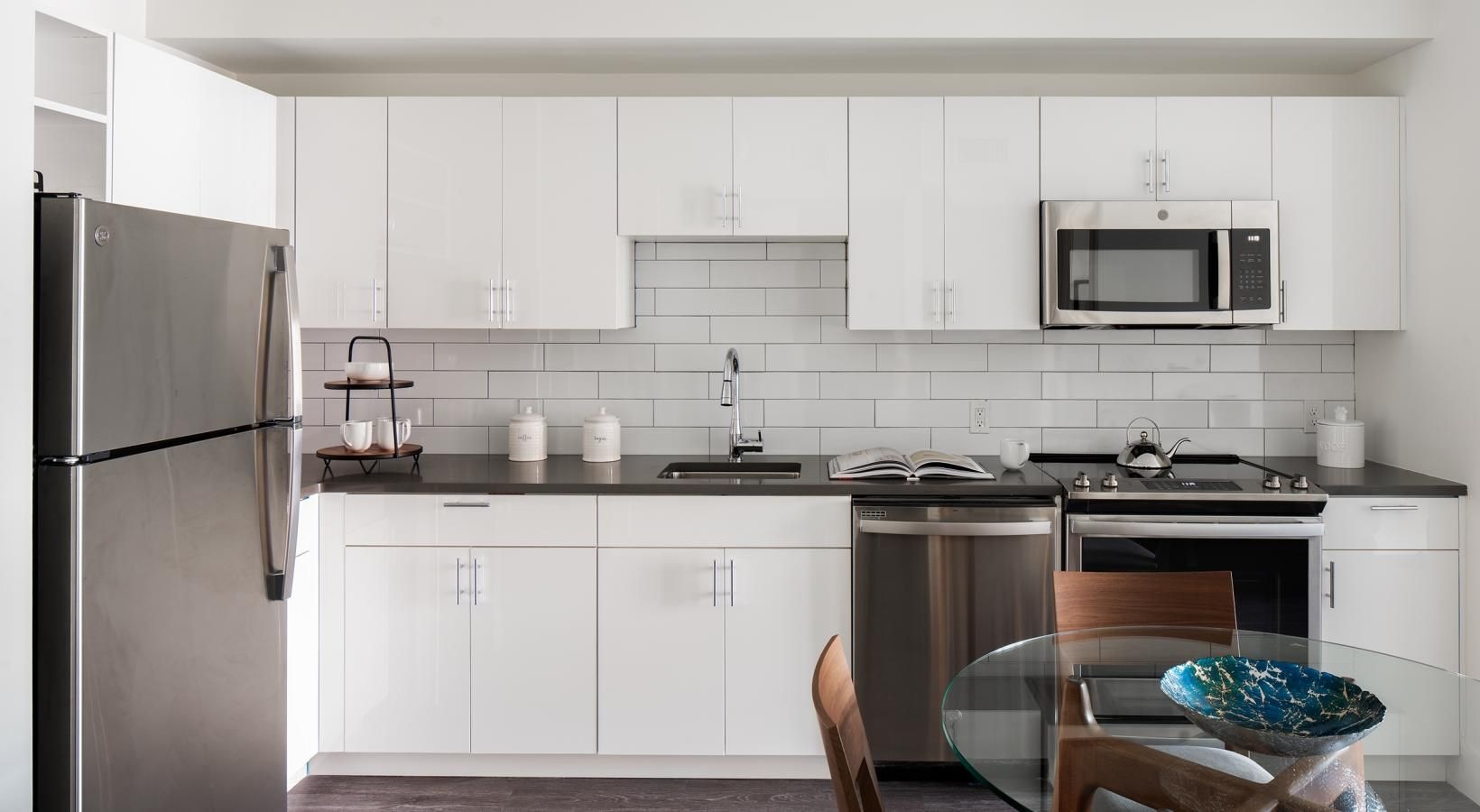 a kitchen with white cabinets