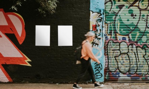 a person walking on a sidewalk