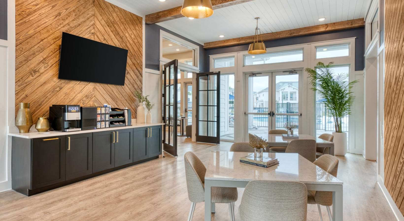 a cafe seating area with a resident coffee bar