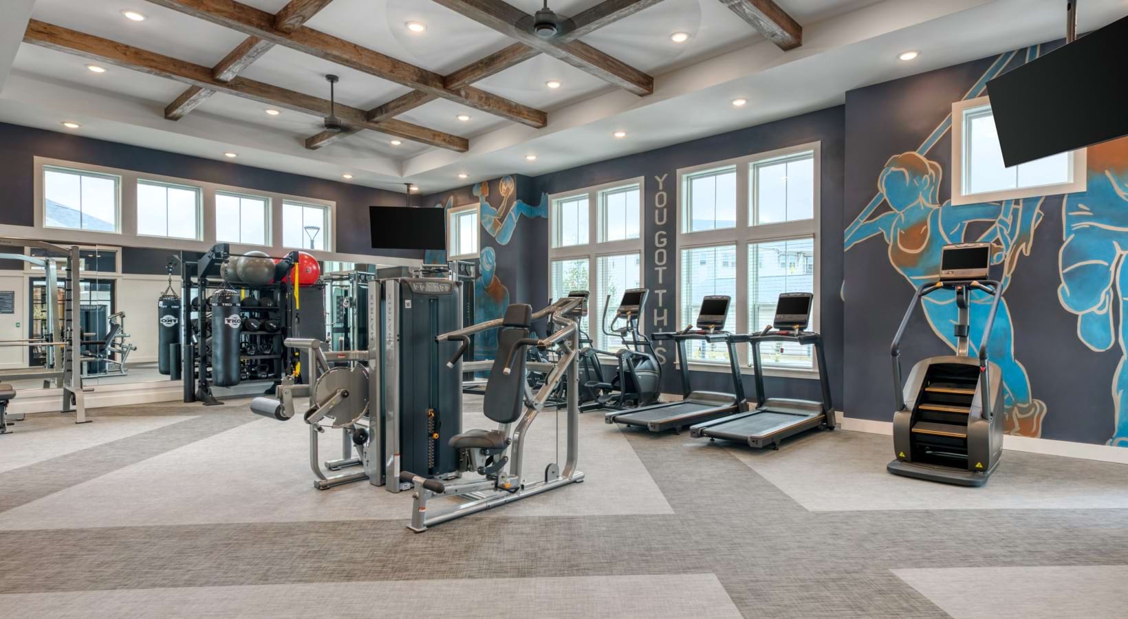 a fitness center with various machines and equipment
